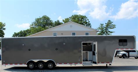 Stock # MVT-23-0122. . Enclosed snowmobile trailer with living quarters